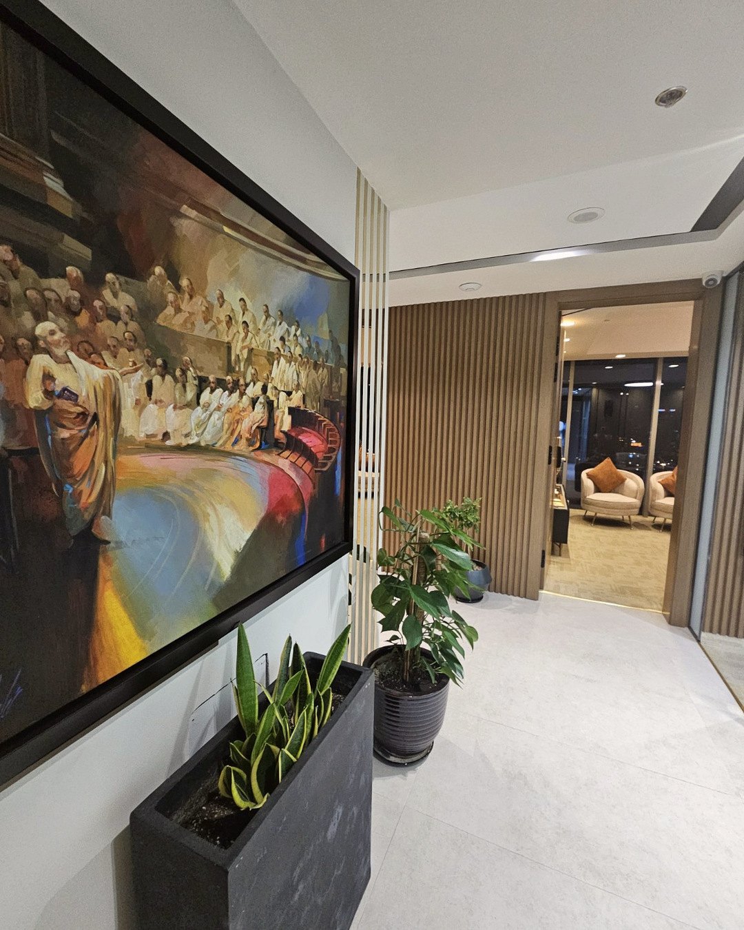 Office hallway with a painting of oratory and advocacy
